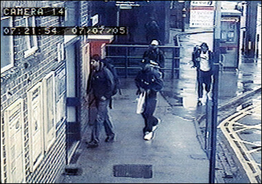 LondonFAKEDvideo-see left arm of man with white hat.jpg